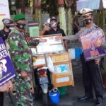 Bawa Poster Wajib Pakai Masker, TNI – Polri Curi Perhatian Pengunjung Car Free Day